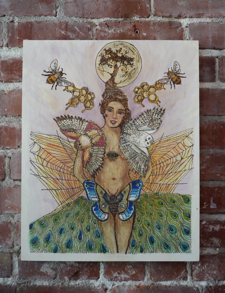 Woman with wings and peacock feathers and a blue butterfly